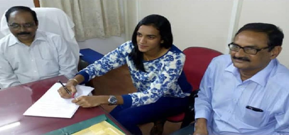 PV Sindhu assumes office as Deputy Collector